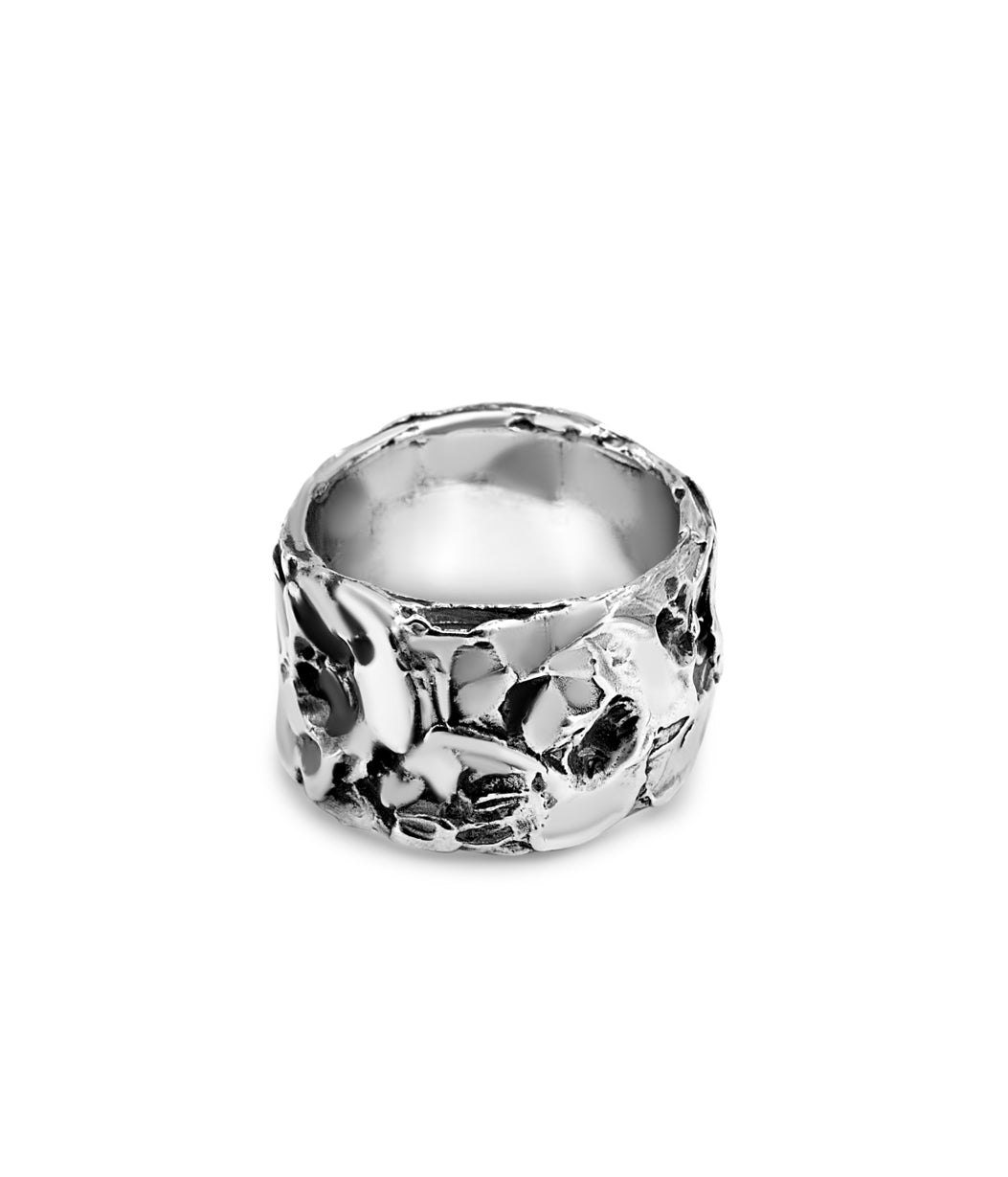 Silver ring with a textured design on a white background