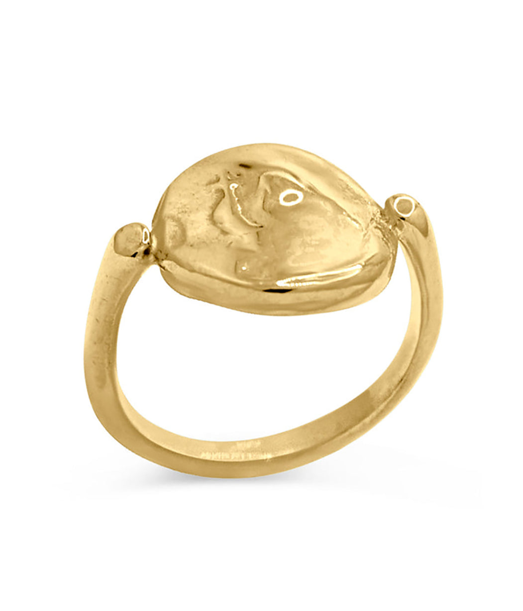 Gold ring with a textured design on a white background
