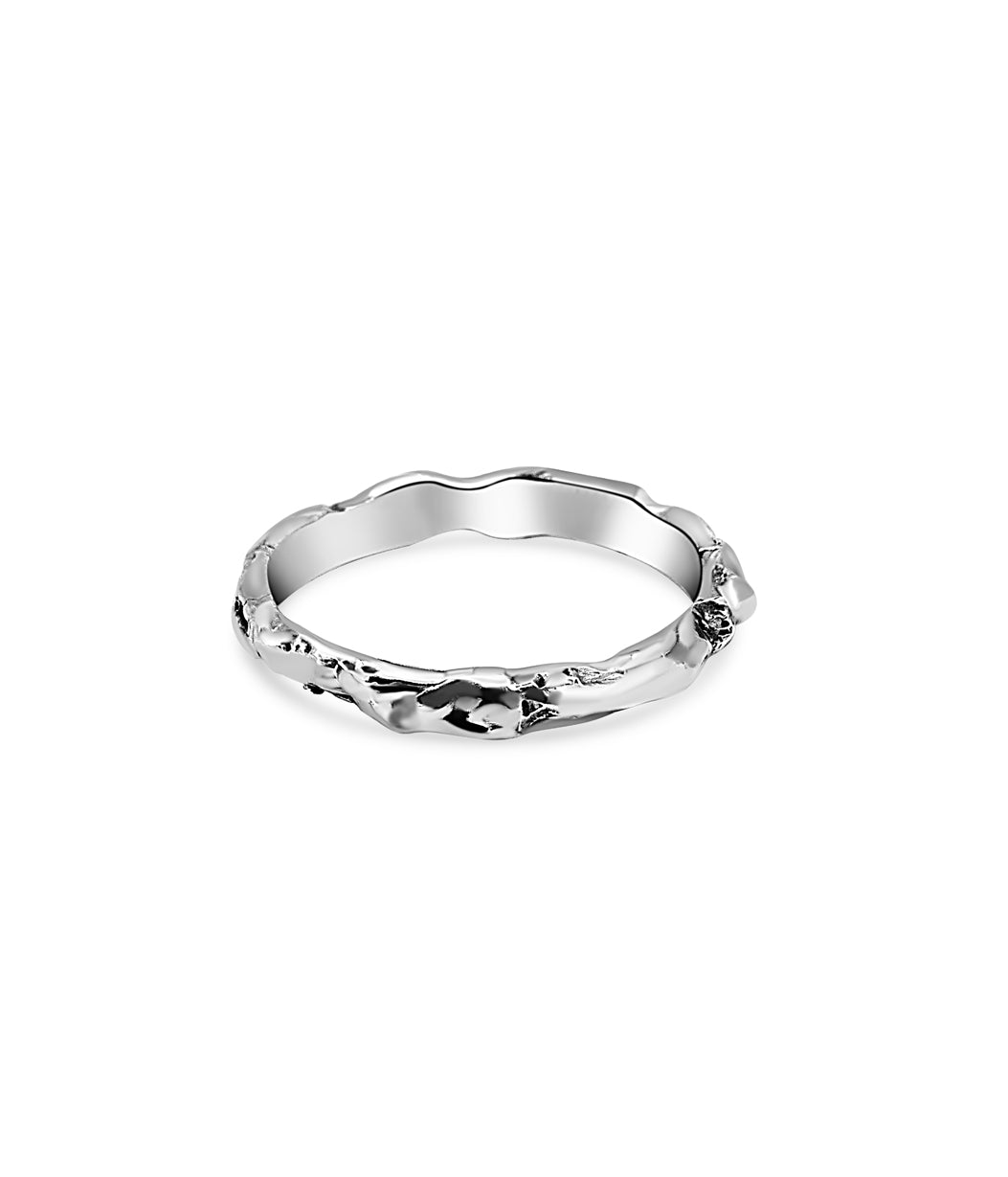 Silver ring with a textured band on a white background