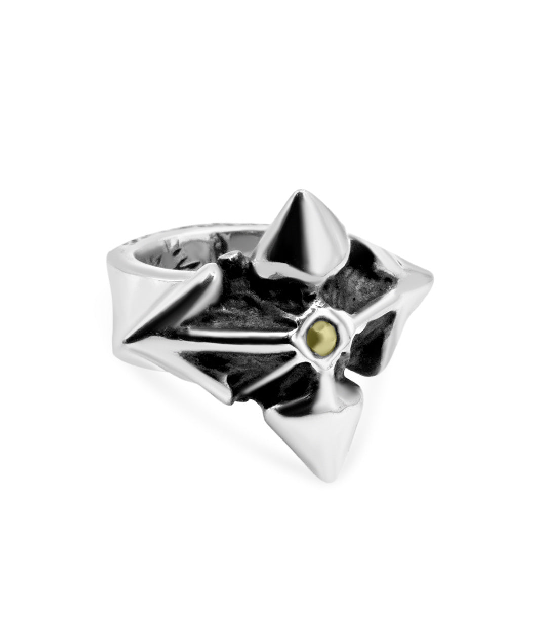 Silver ring with a central gemstone on a white background