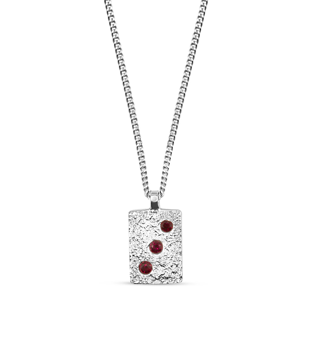 Necklace with a square pendant featuring red stones on a white background