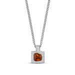 Silver necklace with a square pendant featuring an orange gemstone on a white background