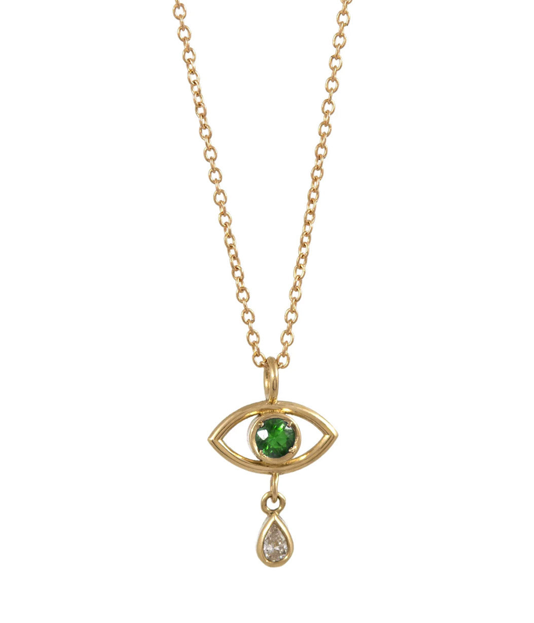 Gold necklace with eye-shaped pendant featuring a green gemstone on a white background