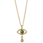 Gold necklace with eye-shaped pendant featuring a green gemstone on a white background