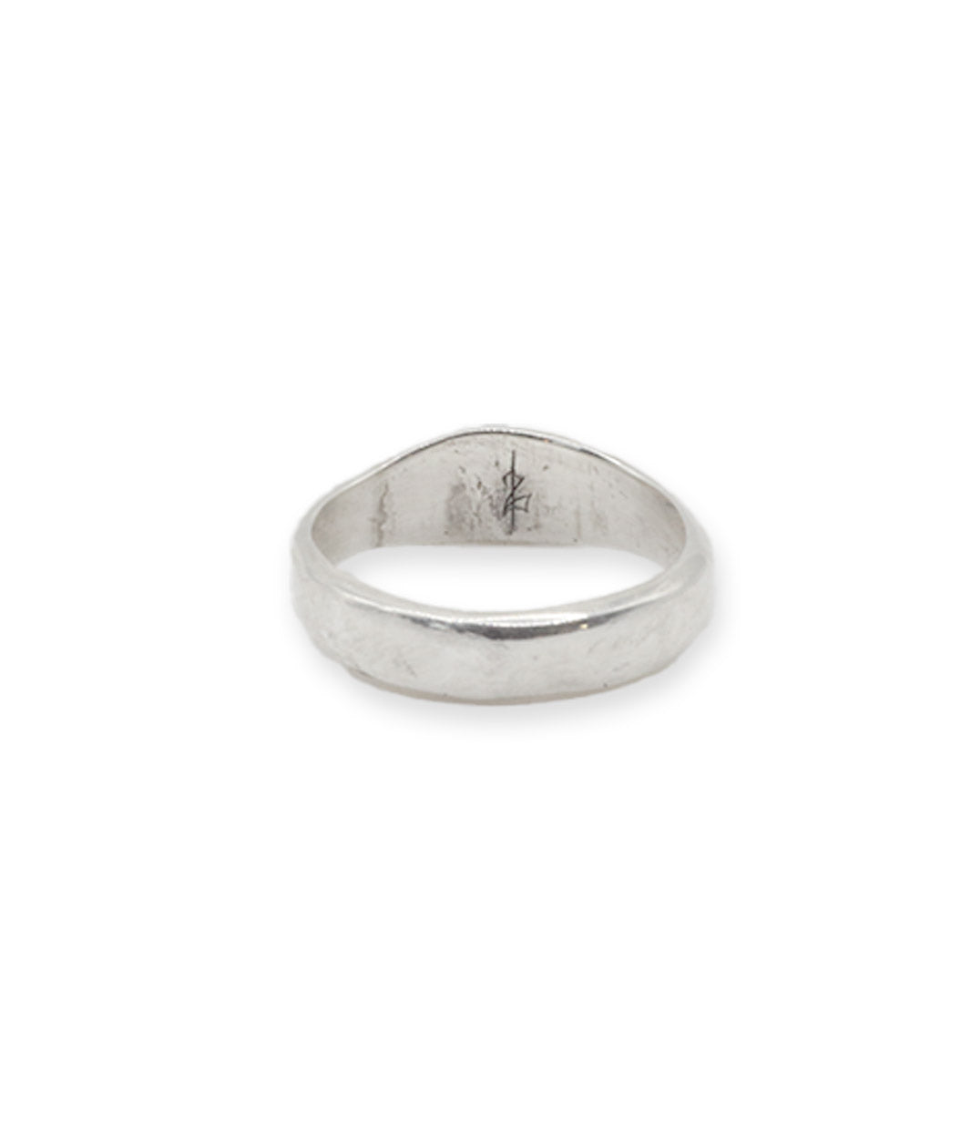 Silver ring with engraved design on a white background