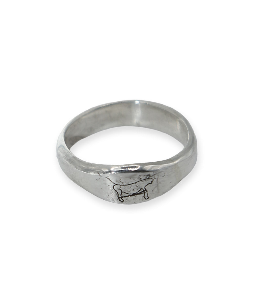 Silver ring with a engraved design on a white background