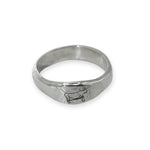 Silver ring with a engraved design on a white background