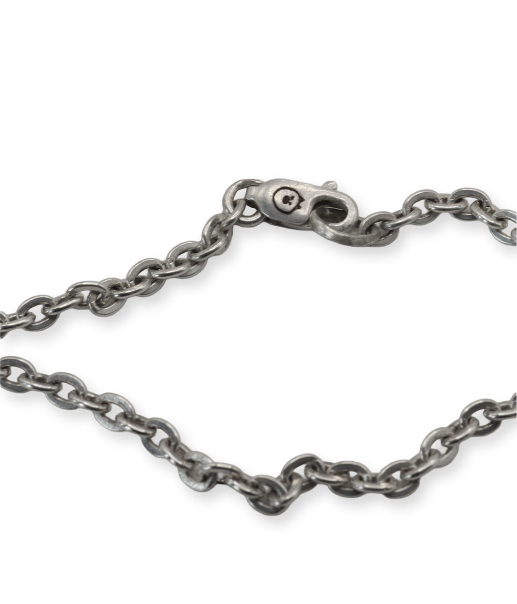 Silver chain bracelet on a white background