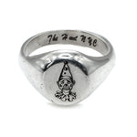 Silver ring with a clown design and 'The Heart NYC' engraving on a white background