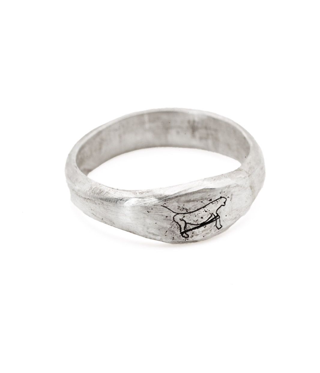Silver ring with a dog design on a white background