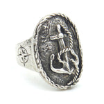 Silver ring with anchor and sword design on a white background
