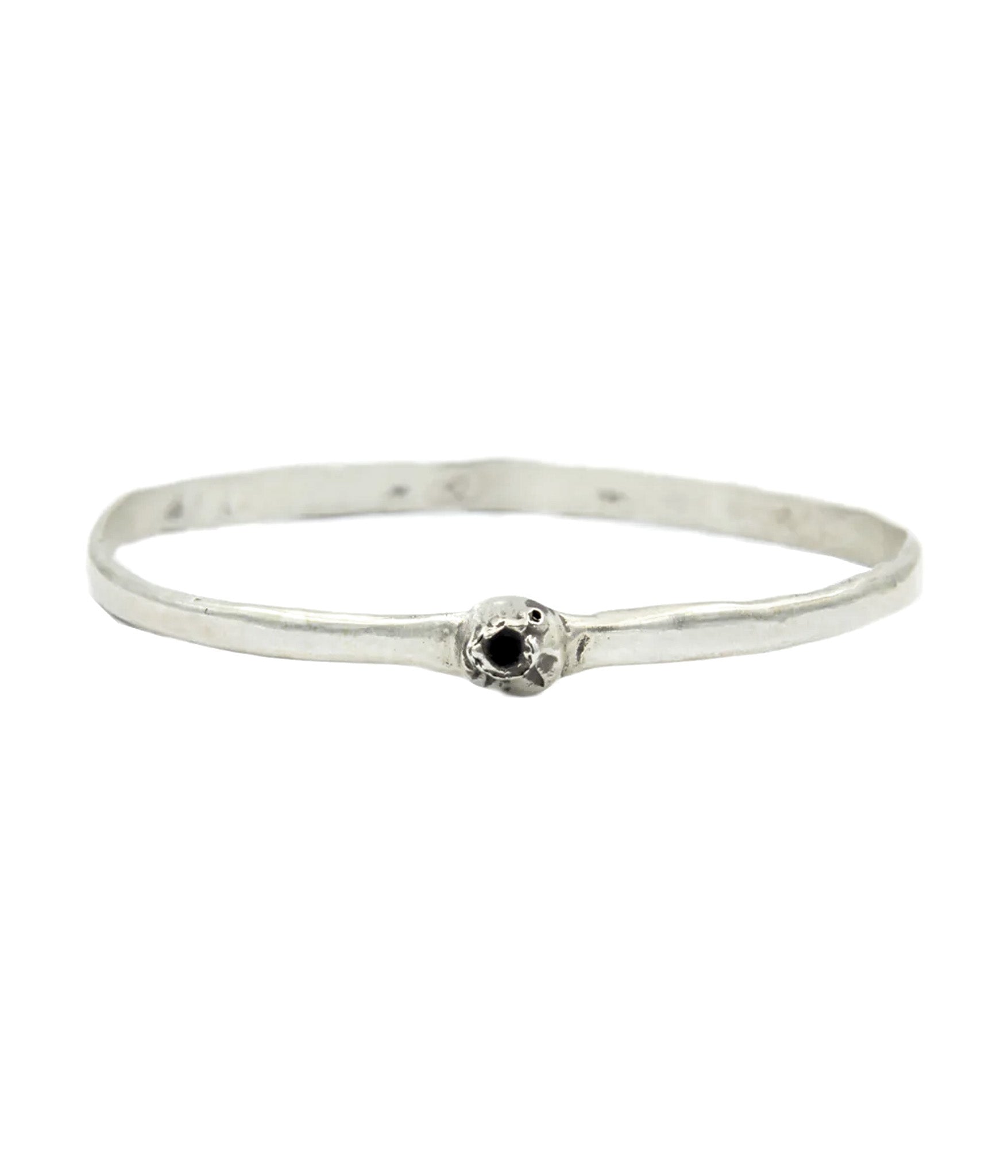 Silver bracelet with a black gemstone on a white background
