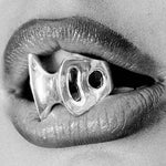 blade ring 2 in mouth in black and white 