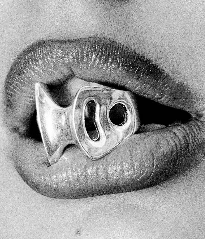 blade ring 2 in mouth in black and white 