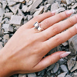 silver blade ring on hand