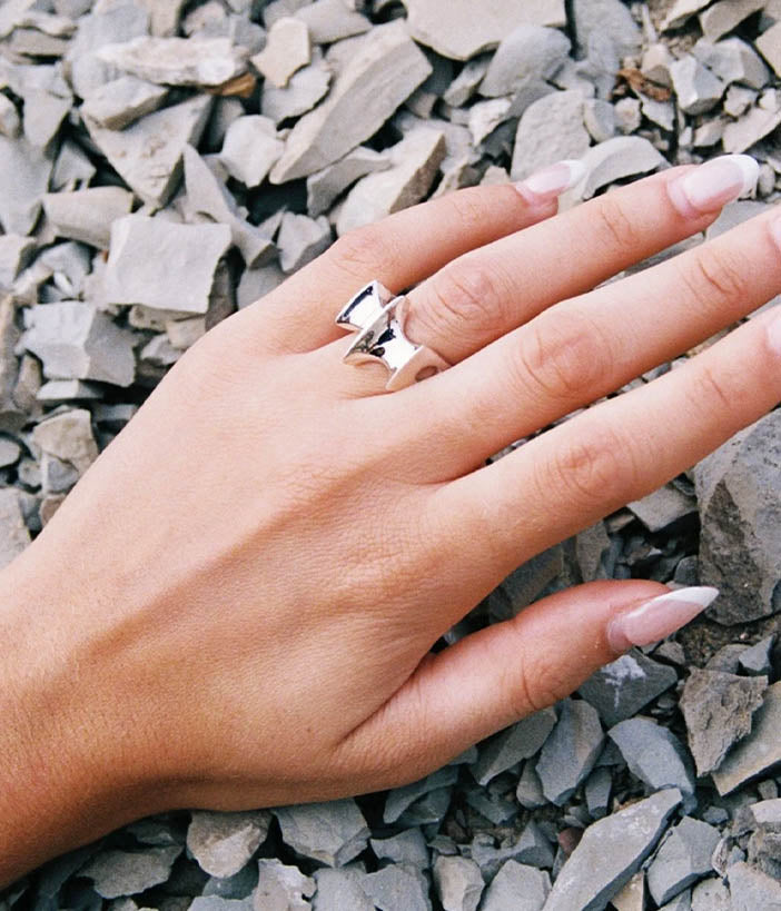 silver blade ring on hand