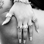 blade ring on hand shot in black and white 