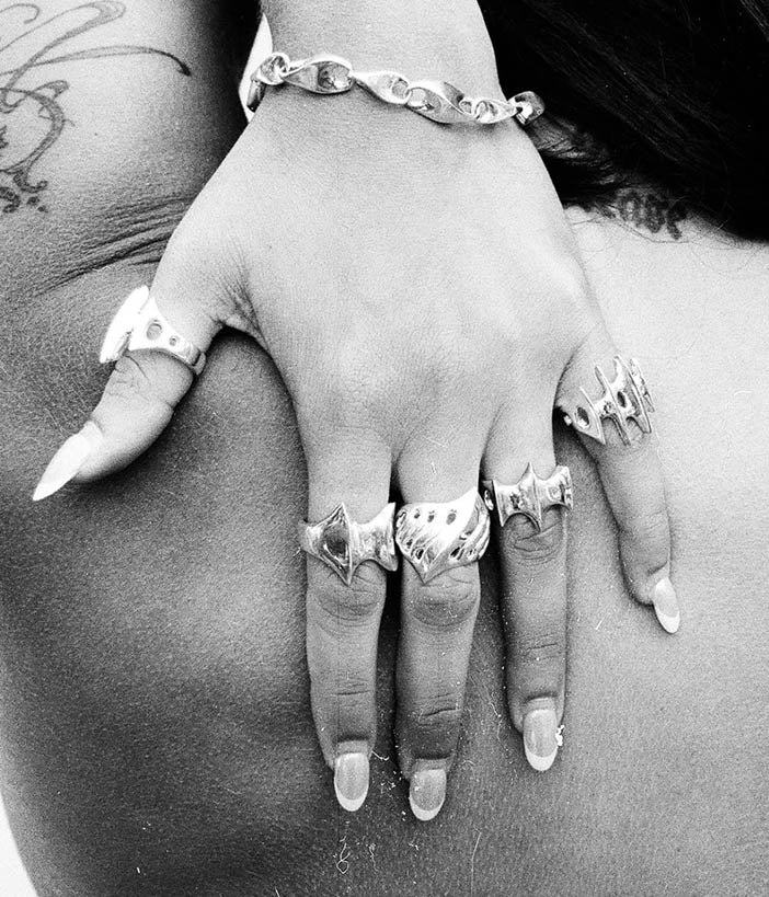 blade ring on hand shot in black and white 