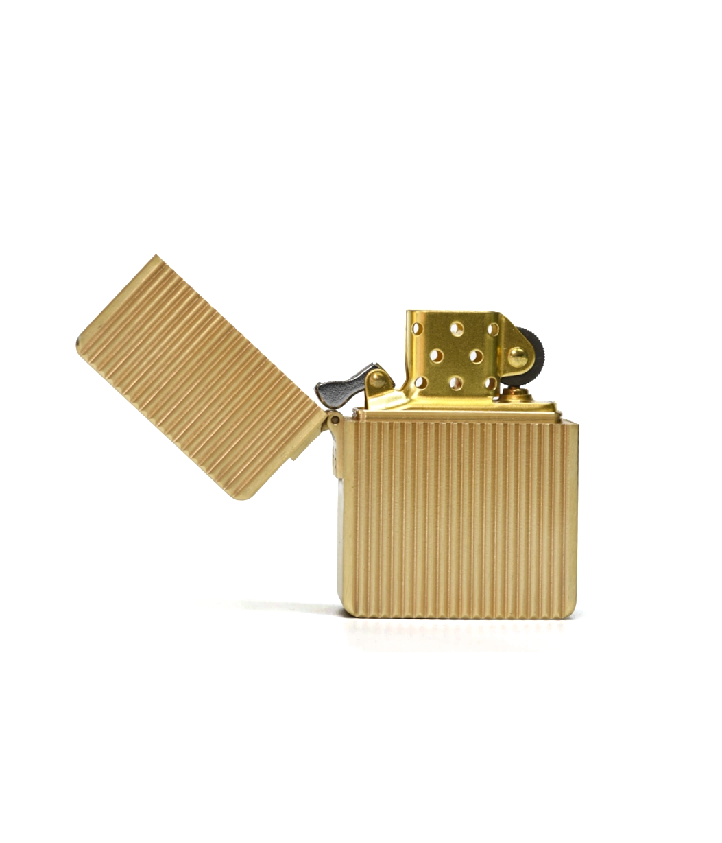 Gold lighter with open lid on a white background
