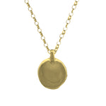 Gold necklace with a round pendant on a white background