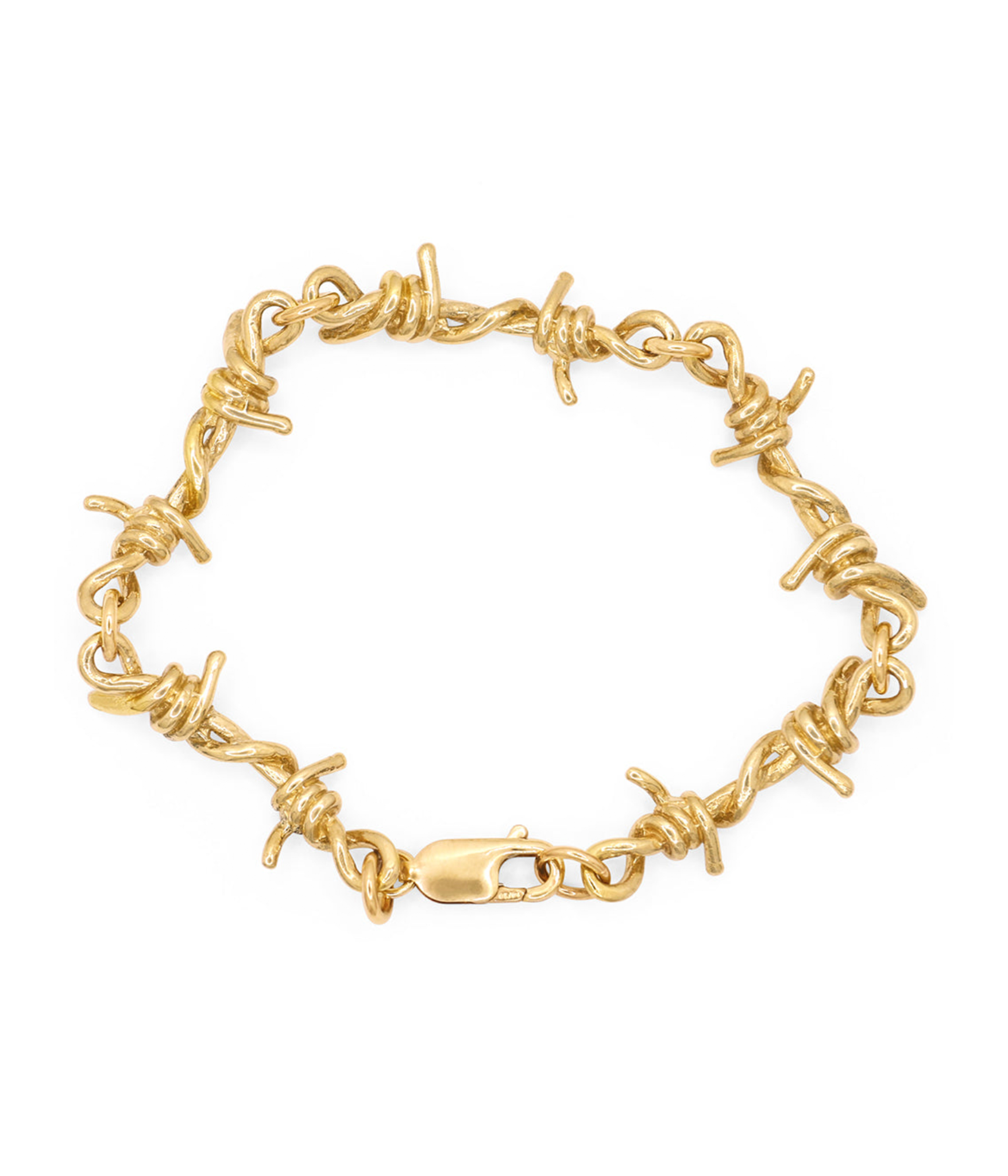Gold barbed wire bracelet on a white background