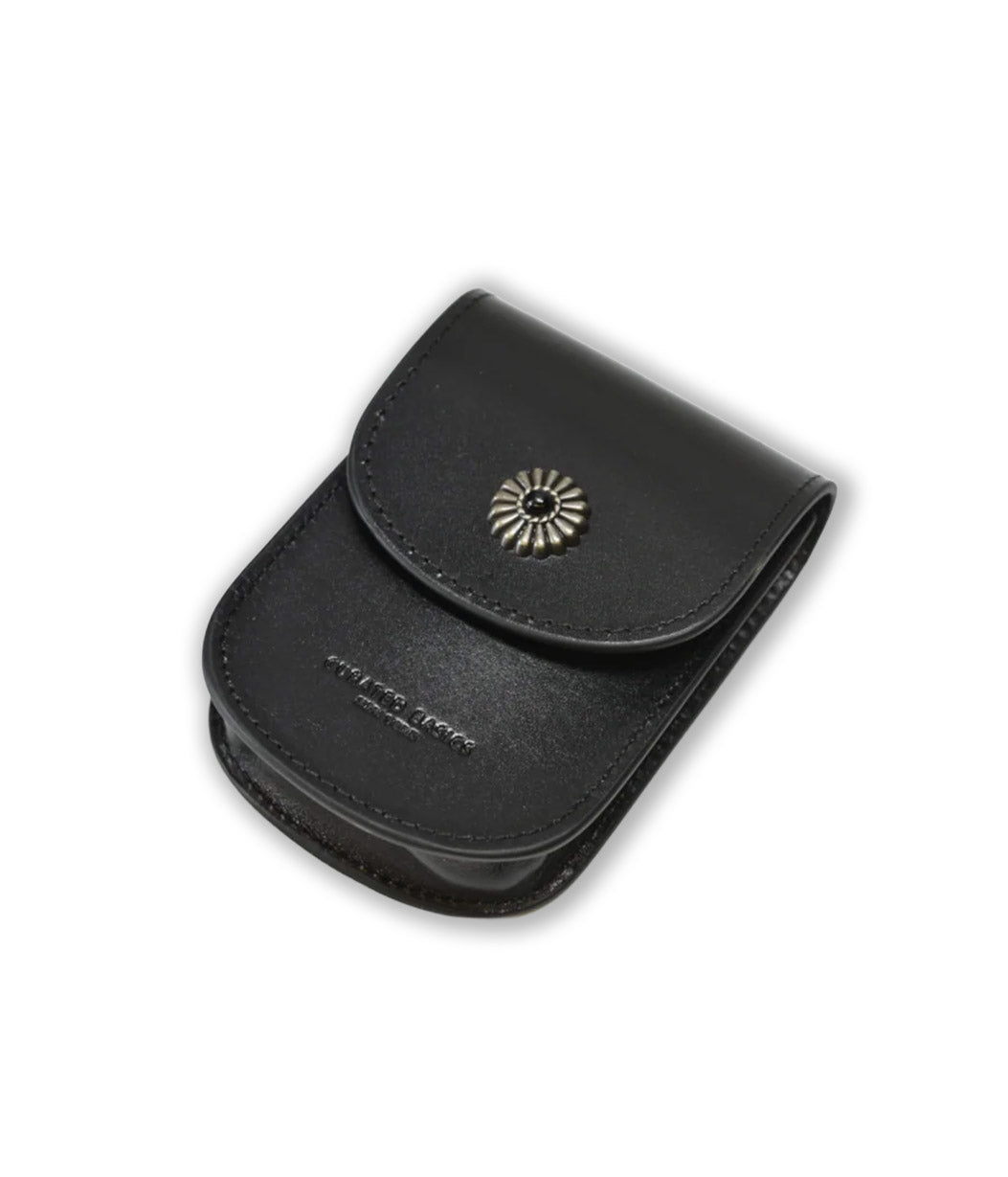 Black leather pouch with a decorative emblem on a white background