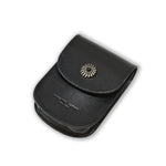 Black leather pouch with a decorative emblem on a white background