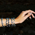 drip bangles on wrist