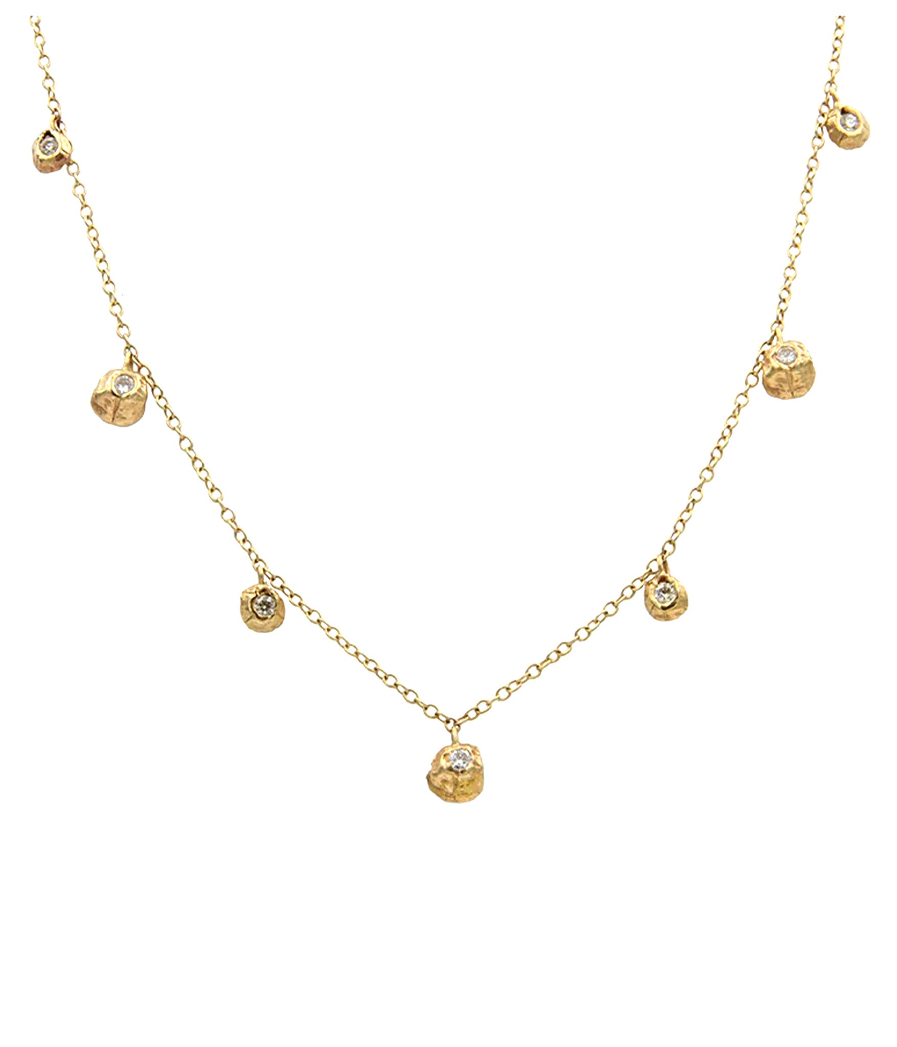 Gold necklace with small round pendants on a white background