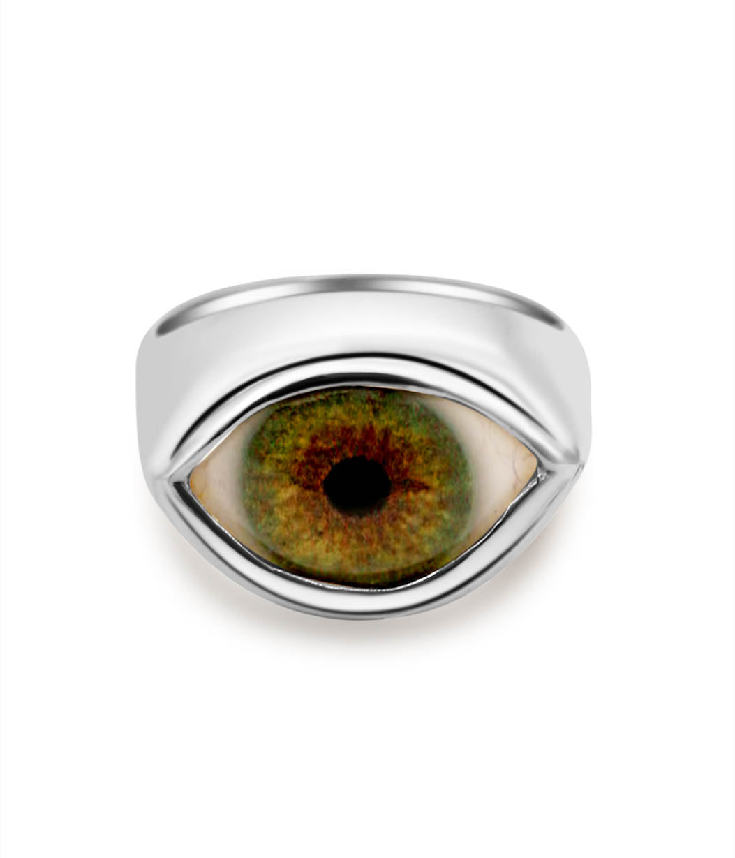 Silver ring with eye design on a white background