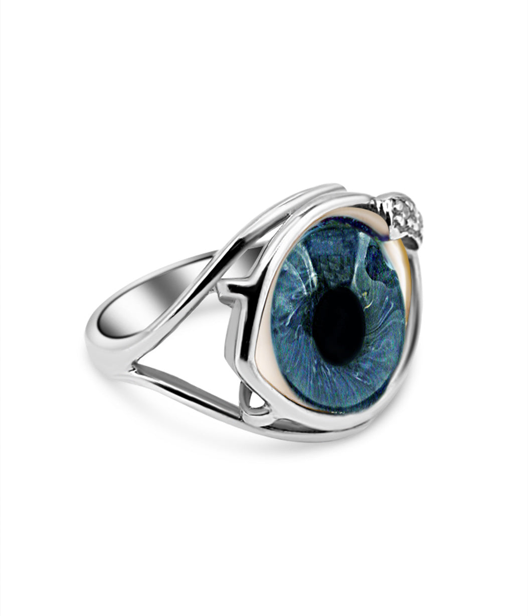 Silver ring with a blue gemstone on a white background