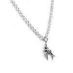 Silver necklace with a small bird pendant on a white background
