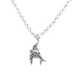 Silver bird-shaped pendant on a chain against a white background