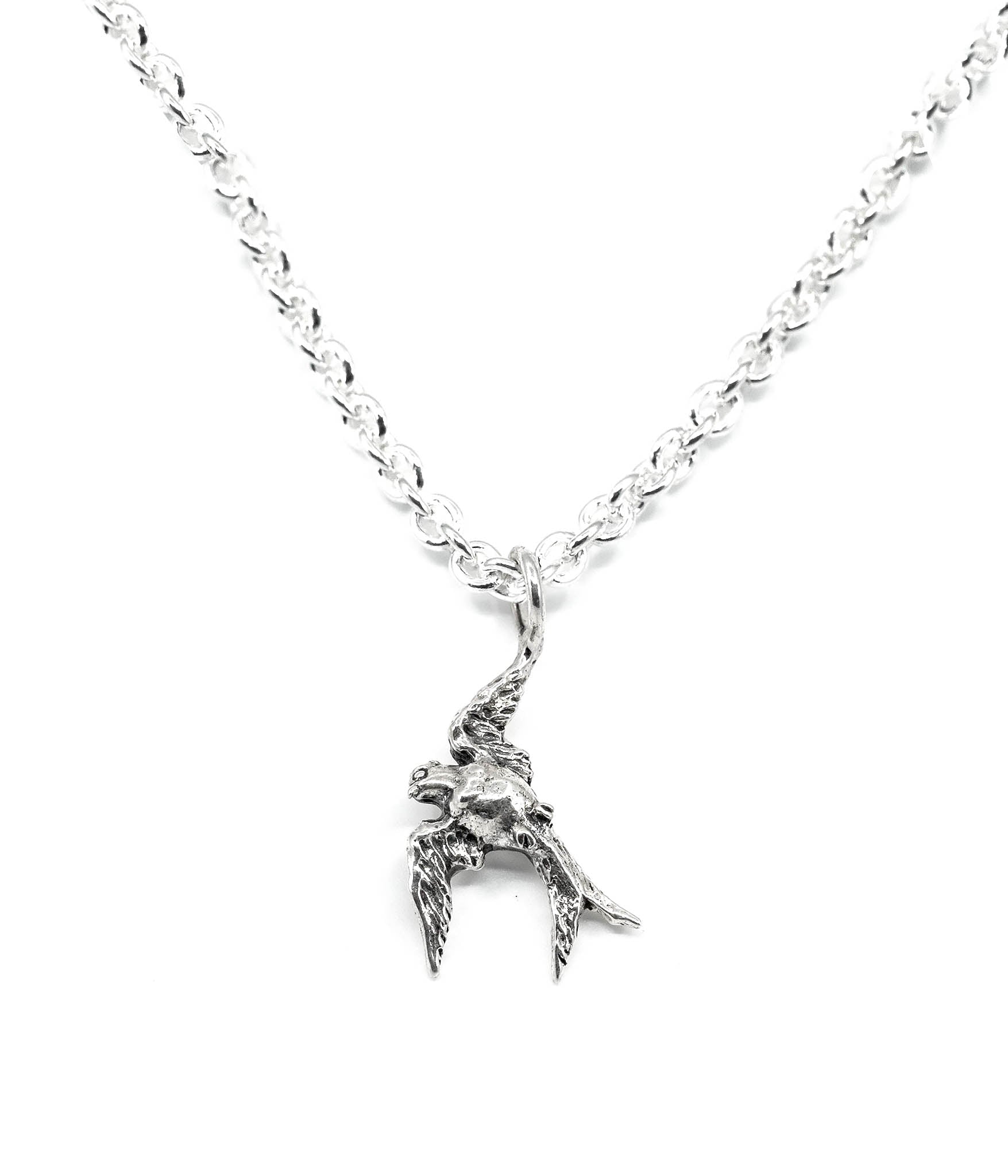 Silver bird-shaped pendant on a chain against a white background