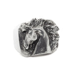Silver horse head ring on a white background