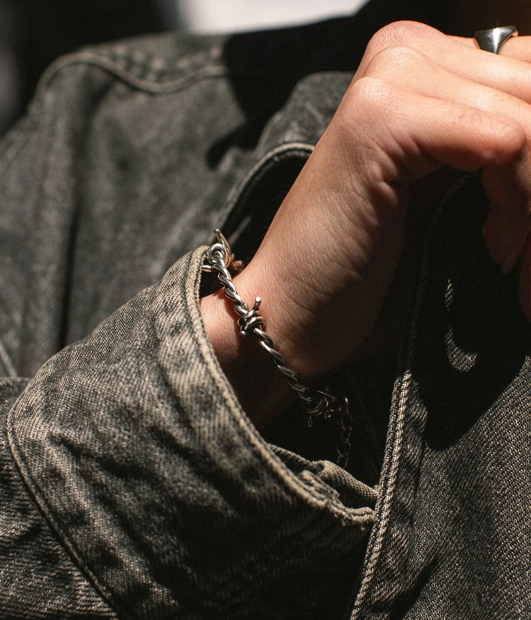 Solid Silver Barbed Wire Bracelet. Shown on models wrist 