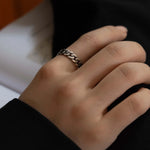 Closeup of THE HUNT NYC FUTABA Cuban Ring worn on model's finger, showcasing polished silver finish and handcrafted chain design