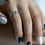 Closeup of THE HUNT NYC FUTABA Cuban Ring worn on model's finger, showcasing polished silver finish and handcrafted chain design