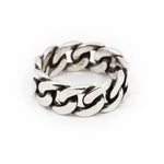 Flat lay of FUTABA Cuban ring in polished silver—modern unisex jewelry design from THE HUNT NYC, handmade with bold minimalist character.