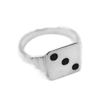 flat lay image of THE HUNT dice signet in sterling silver with 3 small diamonds 