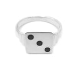 flat lay image of THE HUNT dice signet in sterling silver with 3 small diamonds 