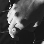 swallow signet on hand in black and white 