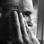 silver swallow signet worn on the pinky on male model in black and white 