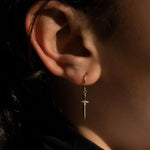 Dagger hoop earring in 14k yellow gold with 3 diamond accent on model 