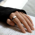 hex ring worn on a model. handmade in sterling silver 