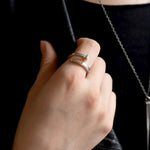 Tough as Nails ring in sterling silver on a model in soft light 