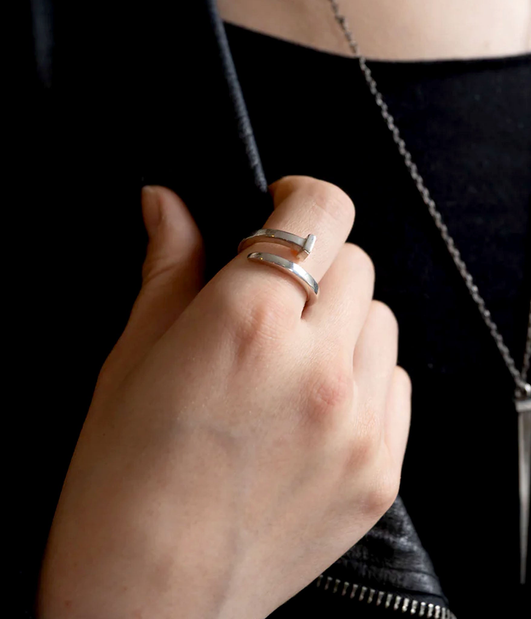 Tough as Nails ring in sterling silver on a model in soft light 