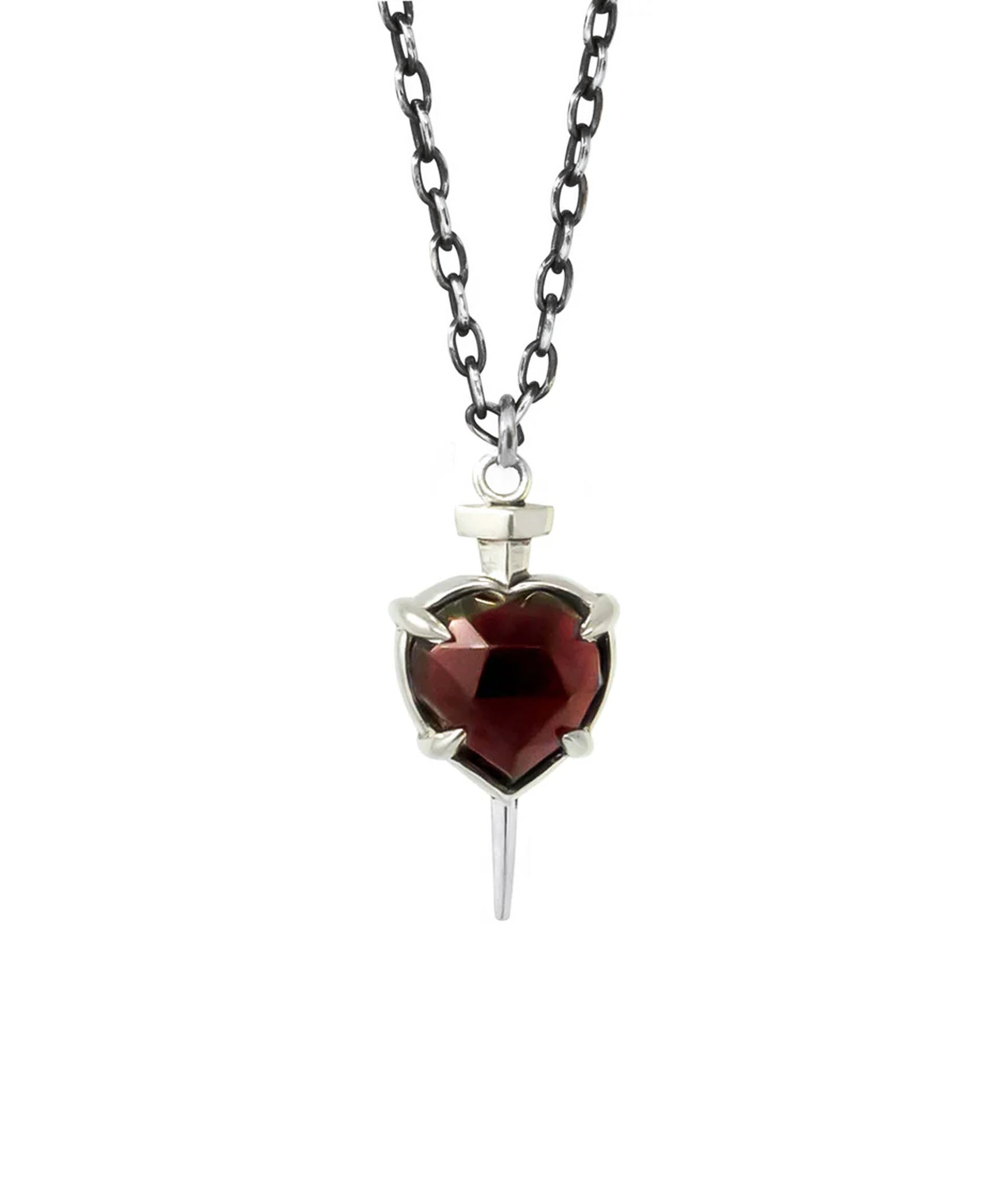 Sterling silver necklace with faceted garnet heart and nail pendant, hanging from dark chain on white background