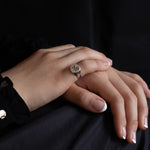 sterling silver signet ring with rose engraving on female model 