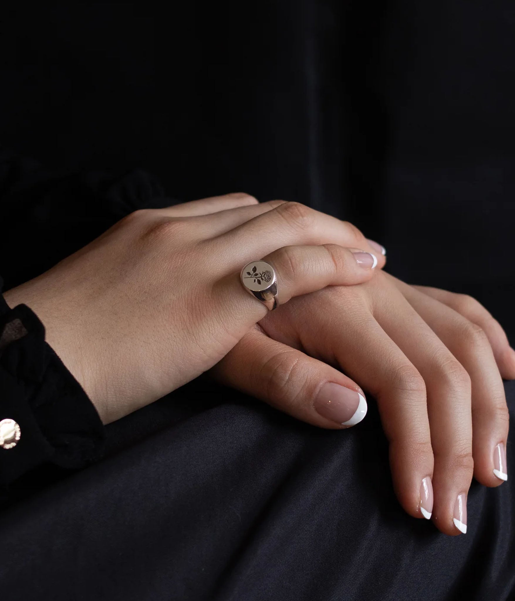 sterling silver signet ring with rose engraving on female model 